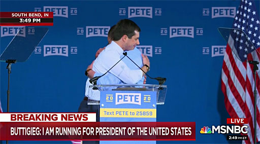 Buttigieg hugs his husband, Chasten, after his speech in South Bend
