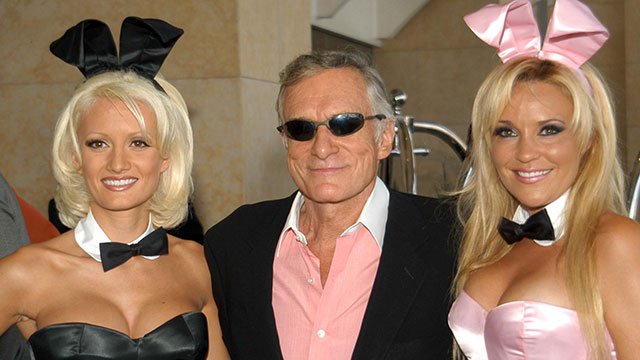 Hugh Hefner and company (image via Depositphotos)