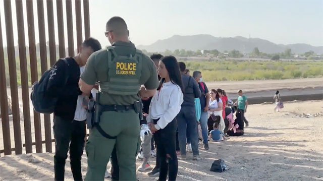 Screen capture of migrants trying to enter the U.S. at the southern border