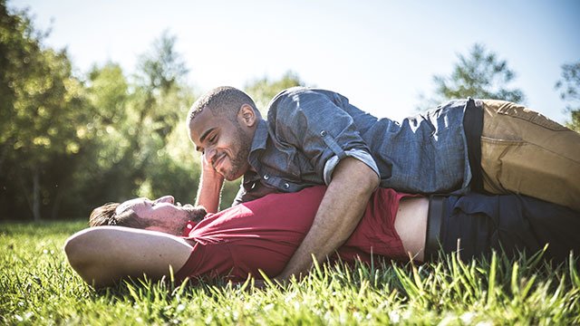 Gay couple on a date (via Depositphotos)