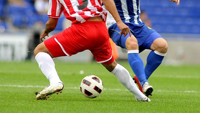 (stock image of male soccer players)