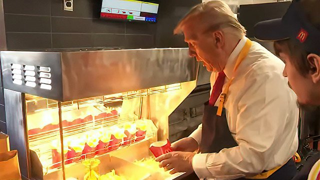 Donald Trump pretends to work a shift at McDonalds
