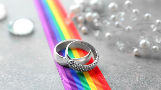Rings and pearls for a lesbian wedding (image via Depositphotos)