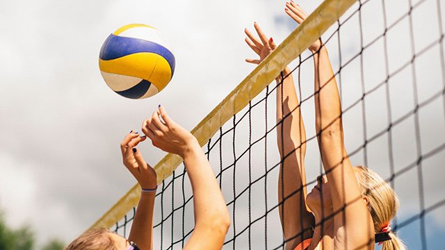 Female volleyball players (via Depositphotos)