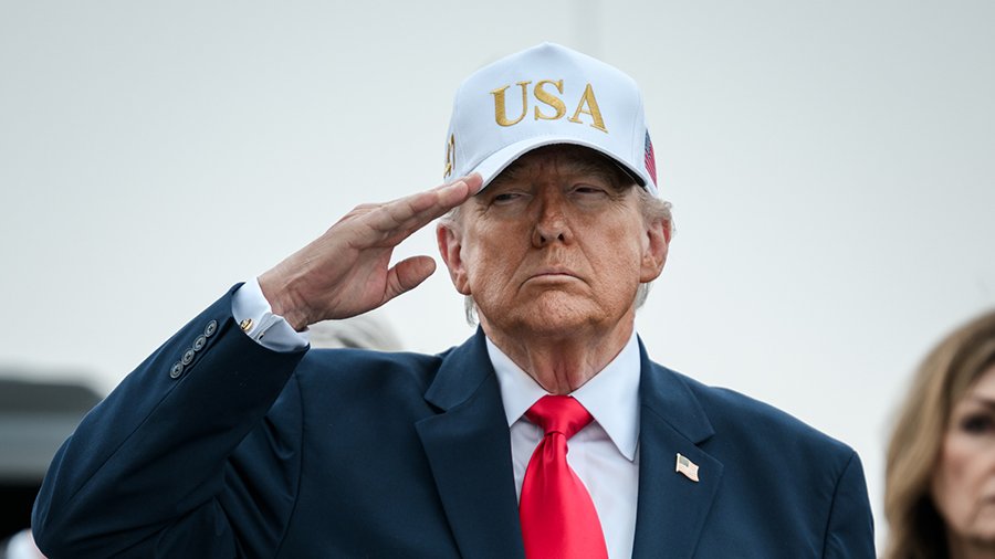 Donald Trump choosing to keep his hat on his head as the bodies of fallen soldiers pass by at a dignified transfer ceremony
