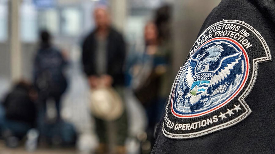 Photo of an ICE agent in airport (via Depositphotos)