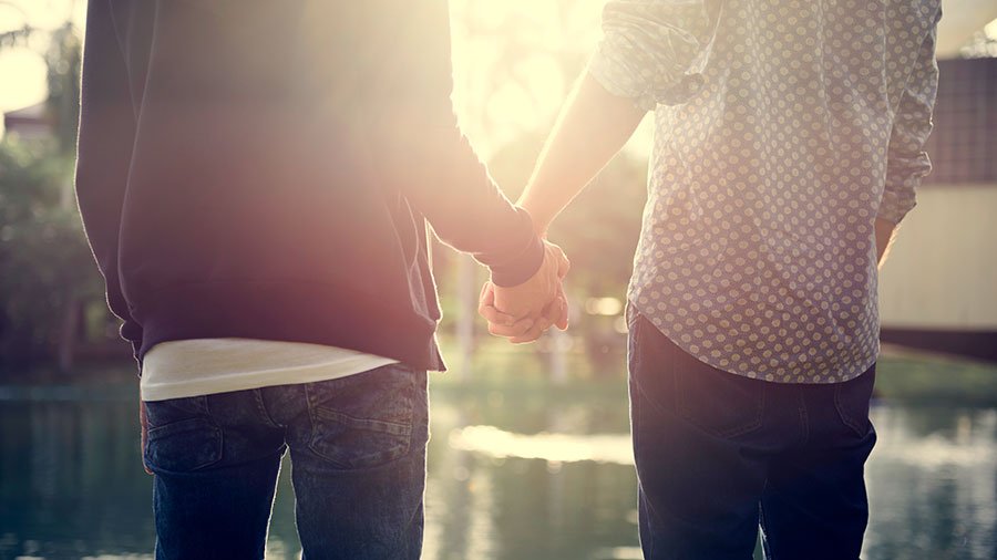 Gay men holding hands