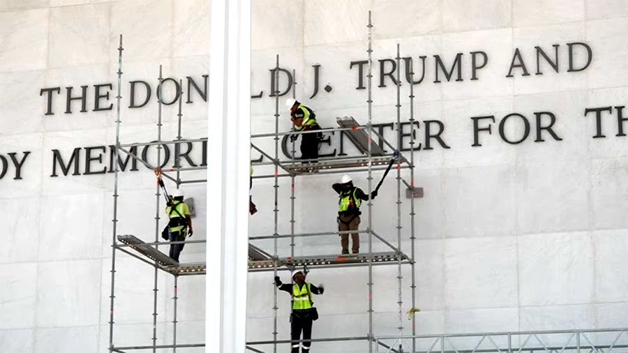 Workers begin the removal of Trump's name from Kennedy Center